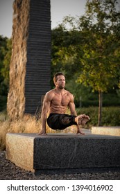 Young Man Practicing Yoga In A Calisthenics Park