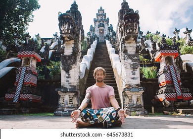 Young Man Practicing Yoga During Luxury Yoga Retreat In Asia, Bali, Meditation, Relaxation, Getting Fit, Enlightening