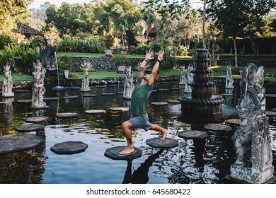 Young Man Practicing Yoga During Luxury Yoga Retreat In Asia, Bali, Meditation, Relaxation, Getting Fit, Enlightening