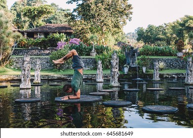 Young Man Practicing Yoga During Luxury Yoga Retreat In Asia, Bali, Meditation, Relaxation, Getting Fit, Enlightening