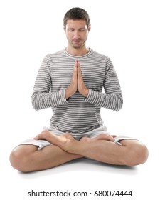 Young Man Practicing Yoga On White Background