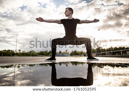 Similar – Black man practicing yoga in urban background.