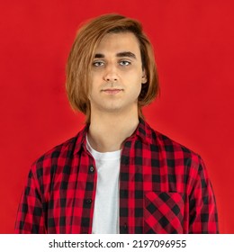 Young Man Prep Student With Long Hair. Portrait Of A Guy. Red Background.