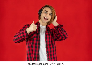 Young Man Prep Student With Long Hair. Portrait Of A Guy Music Lover With Headphones.