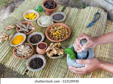 A Young Man Preparing Ayurvedic Medicine In The Traditional Manner.