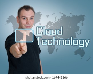 Young man press digital Cloud Technology button on interface in front of him