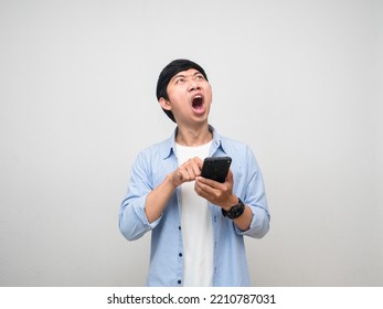 Young Man Press Finger On Mobile Phone Feels Shocked At Face Looking Up Isolated