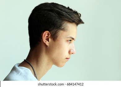 Young Man Profile Face On Grey