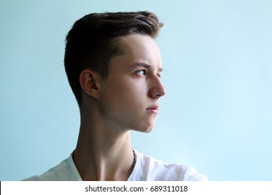 Young Man Profile Face On A Blue Background