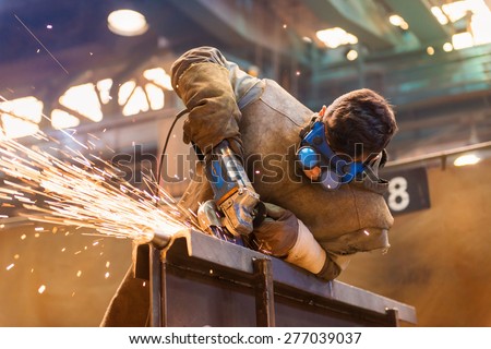 Similar – Image, Stock Photo The worker cuts the parquet on a circular saw