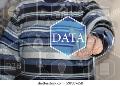 The young man push the web icon DATA in the web network on the touch screen in the web network . 