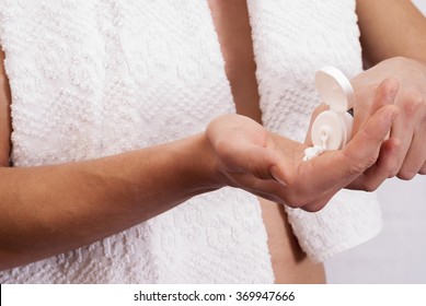 young man put on a hand cream