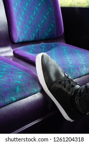 A Young Man Puts His Feet On The Seat Of A Bus To Rest, Putting His Feet Up On The First Bus Service In Hanley, Stoke On Trent, Staffordshire