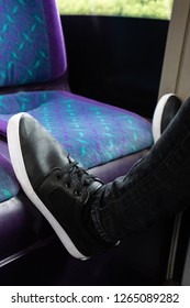 A Young Man Puts His Feet On The Seat Of A Bus To Rest, Putting His Feet Up On The First Bus Service In Hanley, Stoke On Trent, Staffordshire