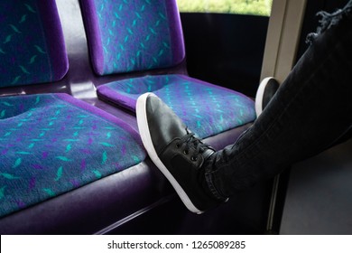 A Young Man Puts His Feet On The Seat Of A Bus To Rest, Putting His Feet Up On The First Bus Service In Hanley, Stoke On Trent, Staffordshire