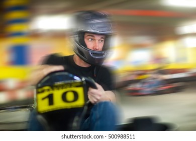 Young Man Racing In Go Cart