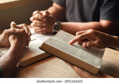 Young Man Reading Bible With Friends Who Are Praying To God Join The Cell Group At The Church. A Small Group Of Christians Or Concepts In A Church At A Church.