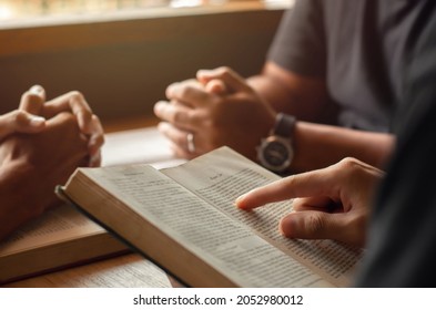 Young Man Reading Bible With Friends Who Are Praying To God Join The Cell Group At The Church. A Small Group Of Christians Or Concepts In A Church At A Church.