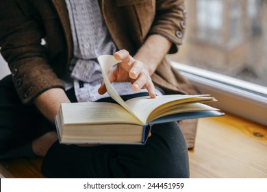 Young Man Reading A Book