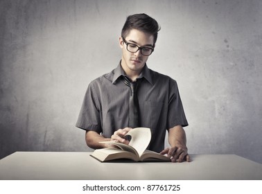 Young Man Reading A Book