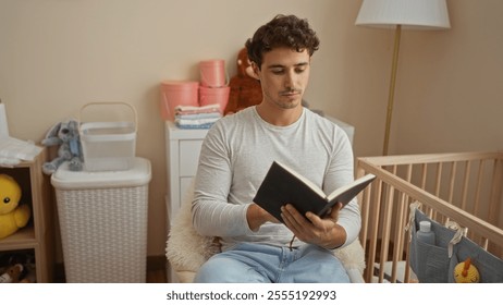 Young man reading book in cozy baby room with crib and stuffed toys, showing thoughtful expression and casual attire, creating a relaxed and nurturing atmosphere. - Powered by Shutterstock