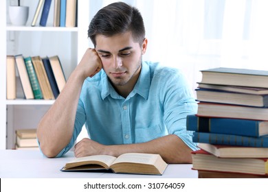 Young Man Reading Book Table Room Stock Photo 310764059 | Shutterstock