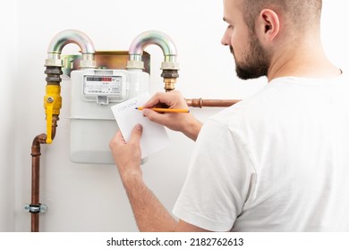 Young man reading the gas meter for calculating high CNG bill in the private house, counter for distribution domestic gas. Inflation concept, increasing prices of natural gas. Compressed Natural Gas
 - Shutterstock ID 2182762613