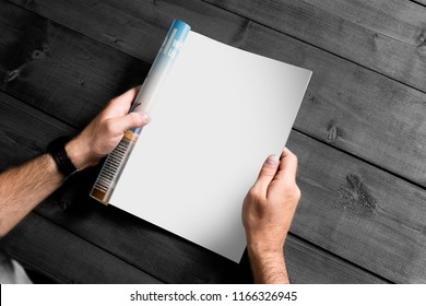 Young man reading magazine - Shutterstock ID 1166326945