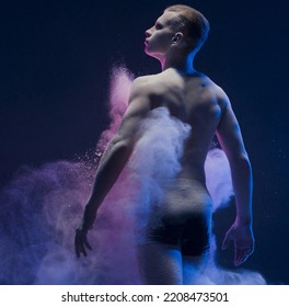 Young Man Rearview In A Cloud Of Color Dust