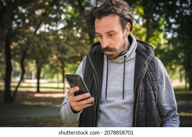 The young man received a very bad and disturbing message on his mobile phone. He is very stunned and shocked and can't believe what he saw