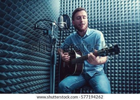 Young man in a recording studio