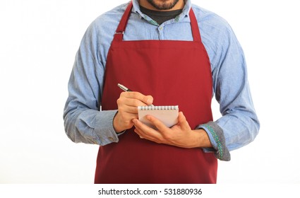 Young man with red apron taking an order on white background - Powered by Shutterstock