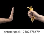 Young man refuses french fries, on dark background. Concept of diet. Concept of fast food rejection. To stop eating fried foods.