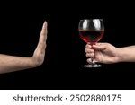 young man refuses a glass of wine. Concept of alcoholism. Treatment of alcohol addiction. Stop drinking alcohol and alcoholism.