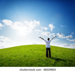 Young Man Relax On The Green Field