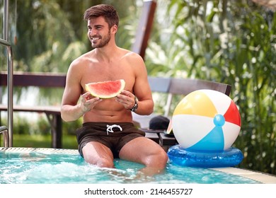 Young man relaxing on summer on swimming pool - Shutterstock ID 2146455727