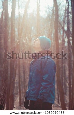 Image, Stock Photo Young man relaxing outdoors during workout in a forest