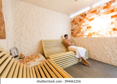 Young Man Relaxing In A Salt Room In The Spa