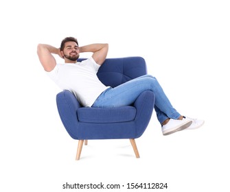 Young Man Resting In Armchair Isolated On White