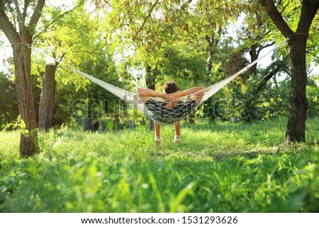 Similar – Foto Bild Young woman relaxing in a hammok