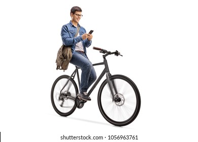 Young Man Riding A Bicycle And Using A Phone Isolated On White Background