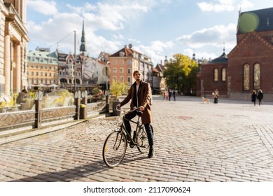 Young man riding bike  Sustainable mobility transport New way inclusive cities mobility  Green transportation  Sustainable climate neutral city goals  Green mobility   transportation