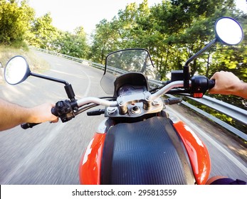 Young Man Riding On Motorbike. POV Original Point Of View