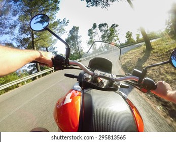 Young Man Riding On Motorbike. POV Original Point Of View