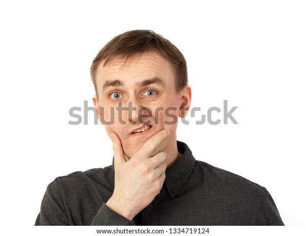 Young Man Rubs His Chin Thought Stock Photo Edit Now 1334719124 young-man-rubs-his-chin-thought-stock-photo-edit-now-1334719124