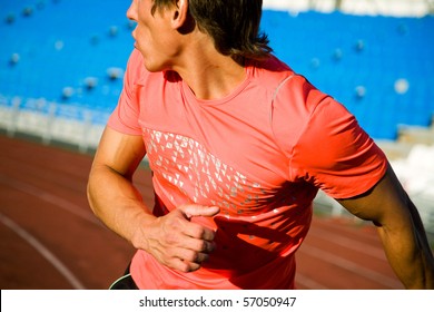 Young Man Runs Through The Stadium And Look Back