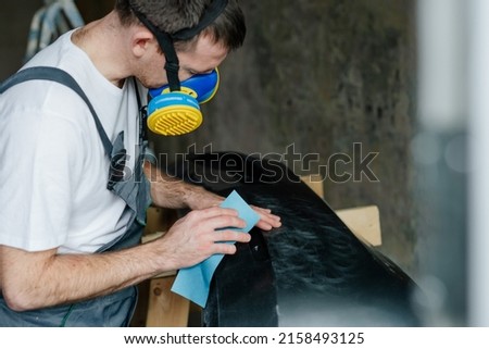 Similar – Foto Bild Nahaufnahme eines Mannes beim Schleifen eines Holzstuhls