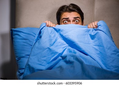 Young Man Scared In Bed