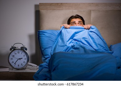 Young Man Scared In Bed