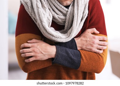 Young man in scarf suffering from cold, closeup - Shutterstock ID 1097978282